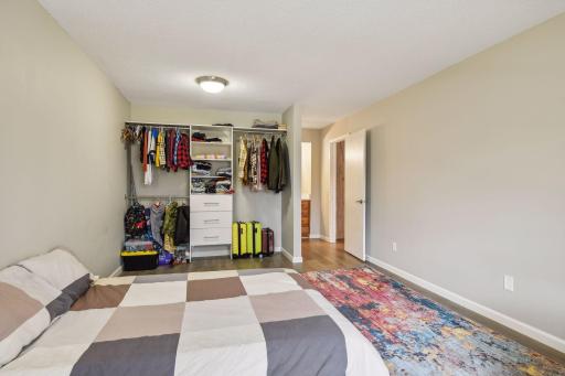 Large closet with built-in closet system, add a rod & drapes or install doors or leave open!