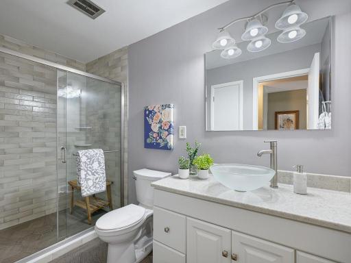 Newly renovated bath with large vanity and walk-in shower!
