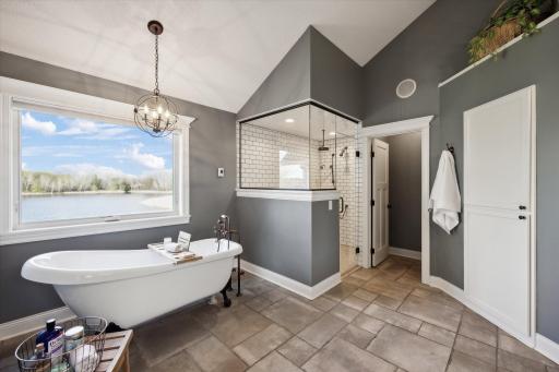 Fully renovated Primary Bath with heated tile floors, soaking tub, and Quartz Countertops!