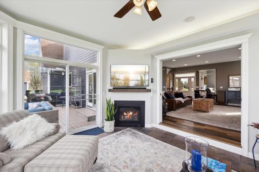 Sun Room boasts the 2nd Fireplace, Ceiling Fan and Tile Flooring.