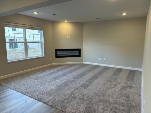 Your new living room is spacious and features an electric fireplace, perfect for those chilly days