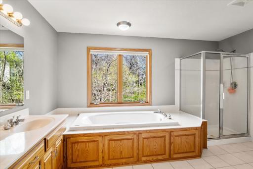 Gorgeous primary full bath with separate tub and shower.