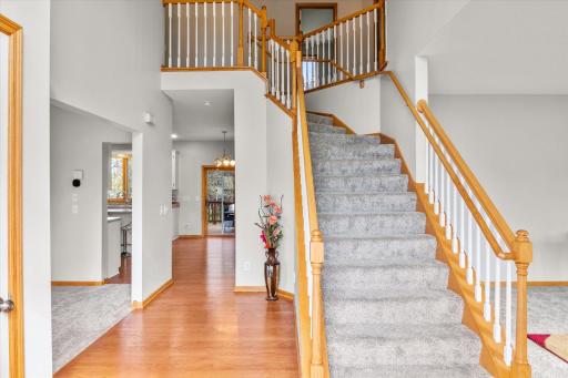 Two story foyer, natural light and gleaming hardwood floors greet you!