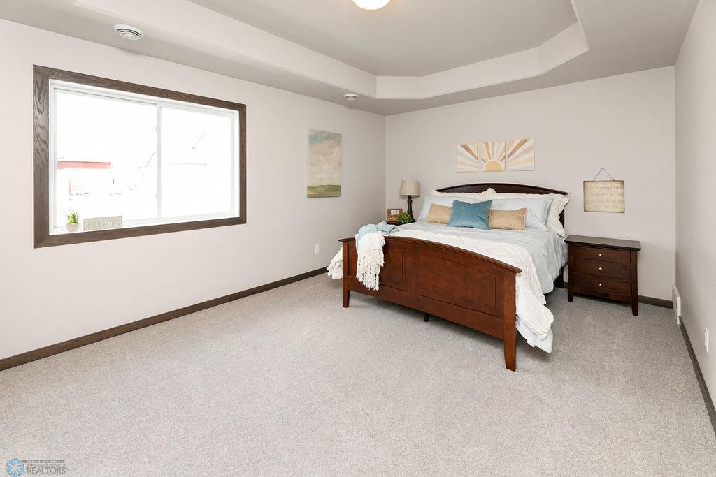 Spacious primary suite with tray ceilings