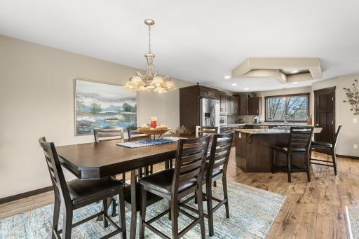 Conveniently located adjacent to the kitchen, find a spacious dining room.