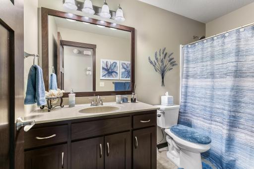 Fully equipped full bathroom with all amenities.
