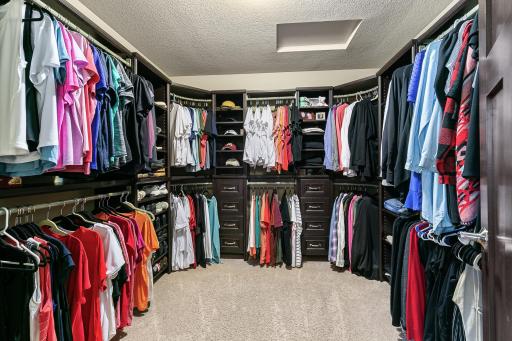 Generous walk-in closet enhances bedroom storage.
