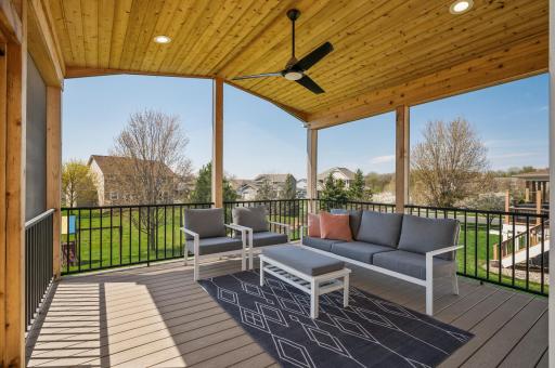 Embrace outdoor living on the expansive newly built three-season screened porch with a 10-foot tongue and groove vaulted ceiling.