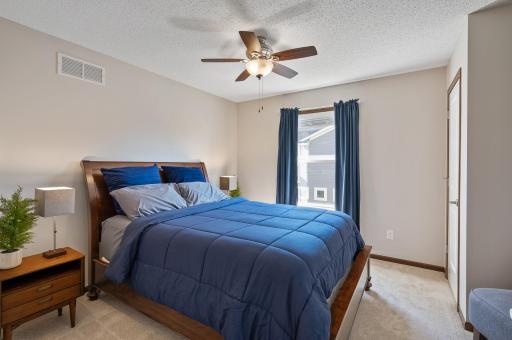 Three additional bedrooms on the upper level, offering comfort and privacy.