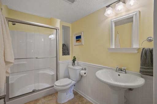Only steps away from the shared full three-quarter bathroom with walk-in shower stall.