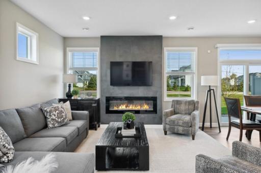 (Photo of decorated model, actual home's finishes will vary) Enjoy the warming electric fireplace as you relax in your family room!