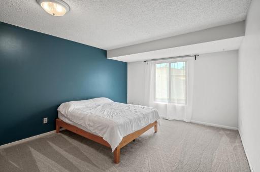 Upper level primary suite with brand new carpet