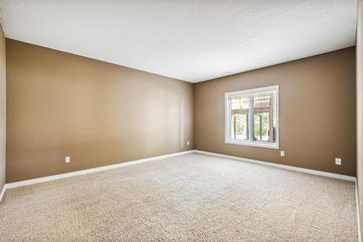 The lower level flex room offers versatile space to suit your needs. It can be transformed into a home office, gym, playroom, guest room, or hobby area, providing adaptable functionality for your lifestyle.