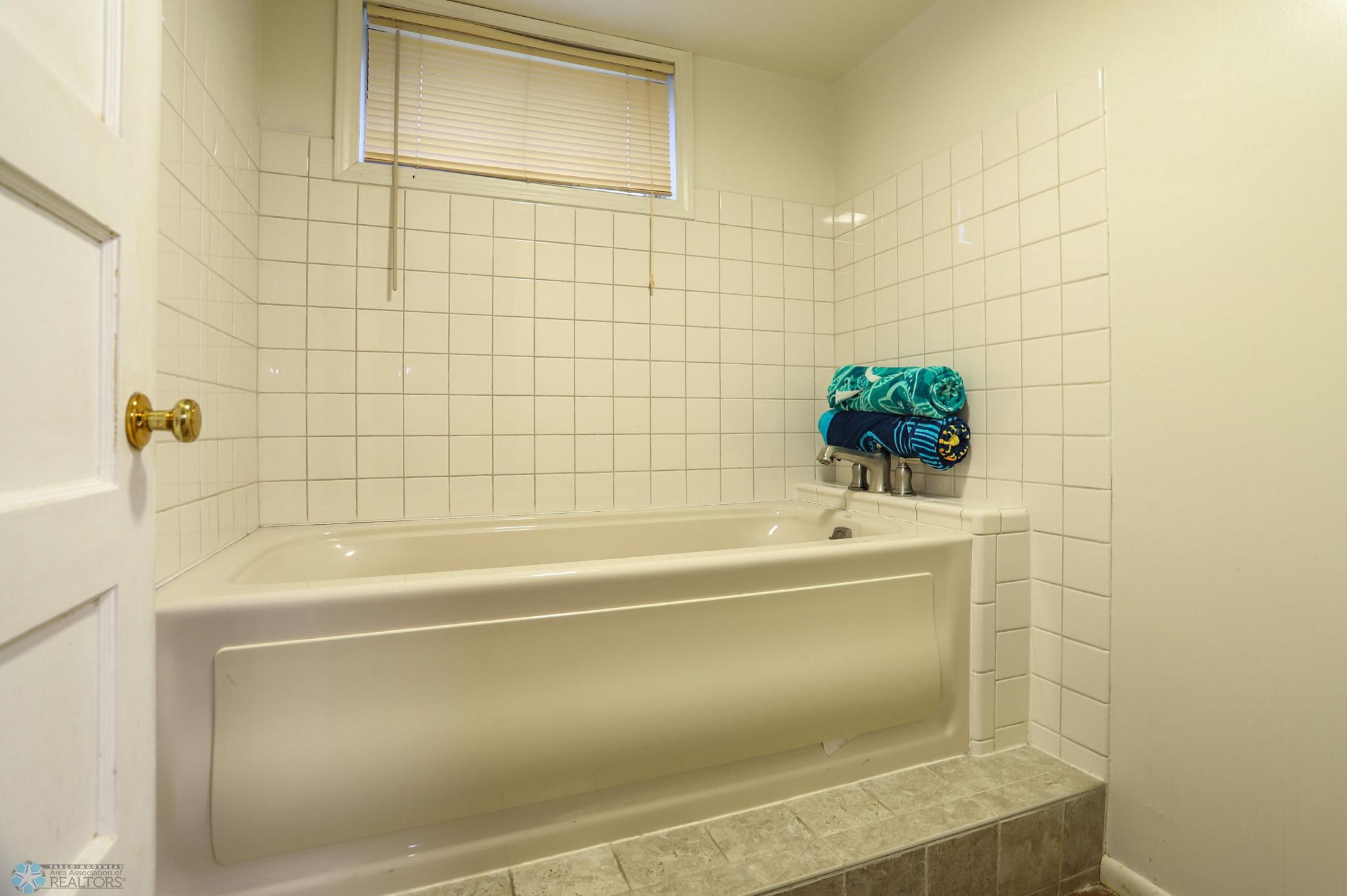 Jetted Tub Room next to Bathroom in Basement