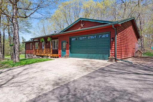 Experience the serenity of nature in this 4-bedroom, 3-bathroom rambler situated on 10 scenic wooded acres, just moments away from Lake Sylvia.