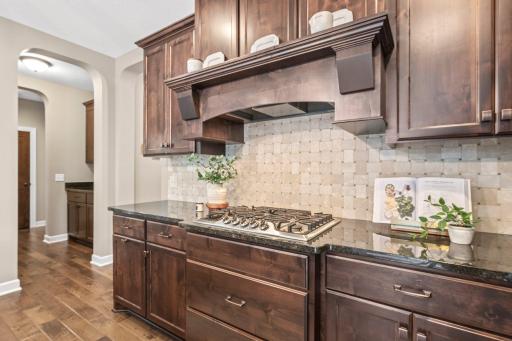 With a gas cooktop, wall oven, and stainless steel appliances, culinary delights are just waiting to be created.