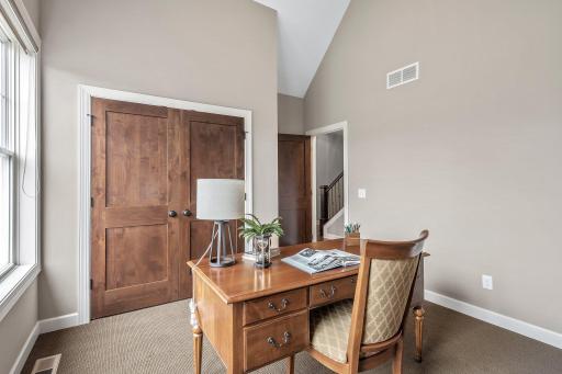 The office/bedroom features upgraded carpeting, large closet and vaulted 12ft ceiling!