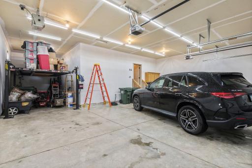 The heated and insulated four car garage with negotiable automotive lift offers plenty of room for hobbies and storage.