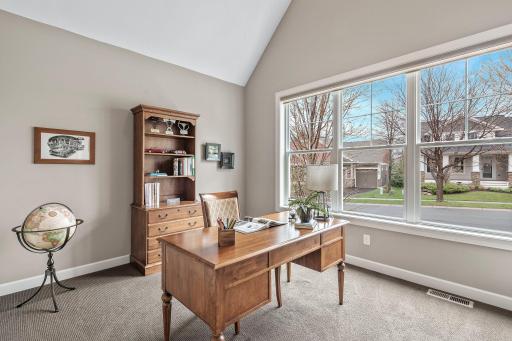 Just off the foyer, discover a versatile third bedroom perfect for an office, and conveniently adjacent to a 3/4 bathroom.