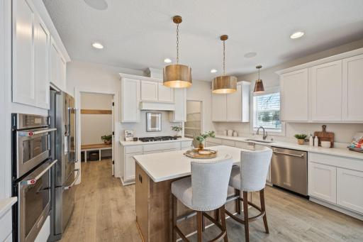 Enjoy entertaining in gourmet kitchen with center island. Close off the mudroom from the kitchen.