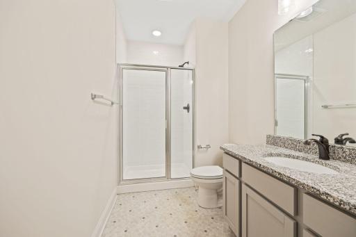 Lower 3/4 bath has granite counters and a nice tiled shower.