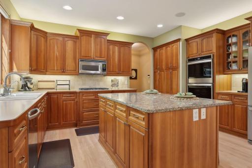 Newer double ovens, glass front cabinets to show off all of your pretties and storage galore.