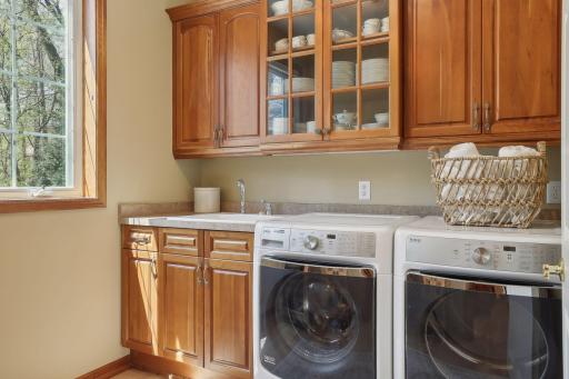 Even the laundry room is GORGEOUS! What a great place to store additional kitchen items or whatever is needed.
