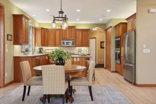 Note details like arched openings and custom cherry cabinetry and millwork throughout!