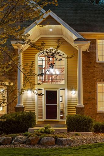 Two story foyer extends to the exterior with covered stoop protecting your family and friends from the elements.