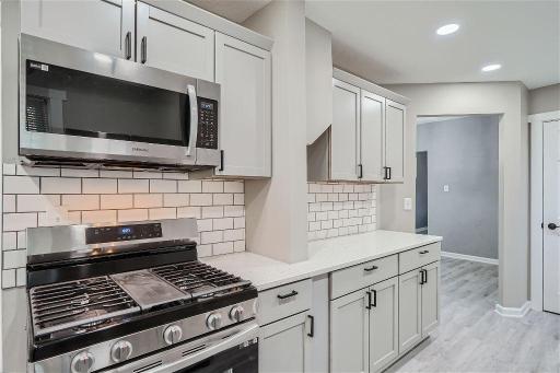 Sleek gray cabinets with on-trend hardware!