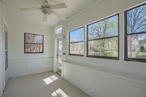 The front porch is filled with tons of natural sunlight - a great space to enjoy your morning coffee!