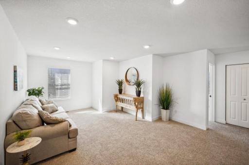 Upper level features 4 bedrooms, a family room, and convenient laundry room.