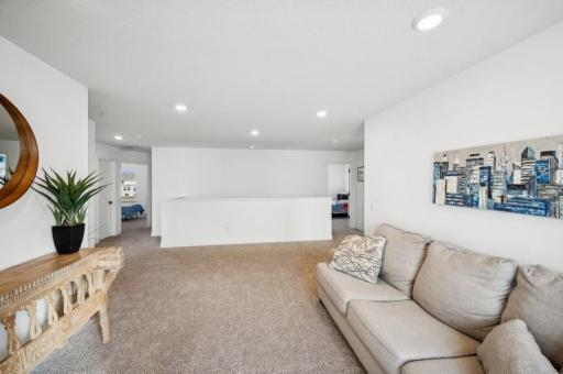 Upstairs features 4 bedrooms, a family room, and convenient laundry room.