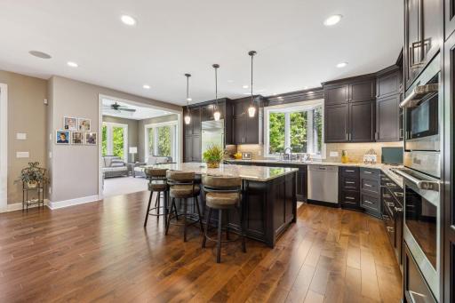 Kitchen has Custom cabinetry, large center island, Granite countertops, Under counter lighting, and all top end appliances. Reverse Osmosis for drinking water as well.