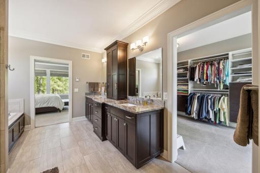 Beautiful custom walk-in closet designed by "California" closets.
