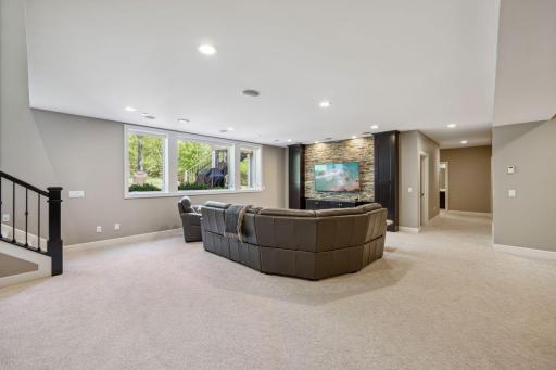 Lower level has large recreation area with Stone backdrop for TV.