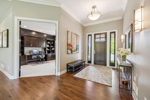 Spacious entry with Walnut engineered Wood floors. Stylish wall Sconces.