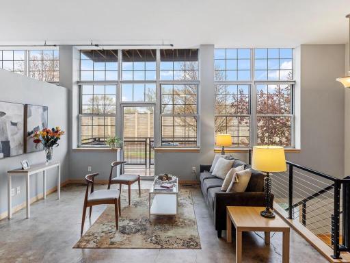 Bright open living room with East facing windows