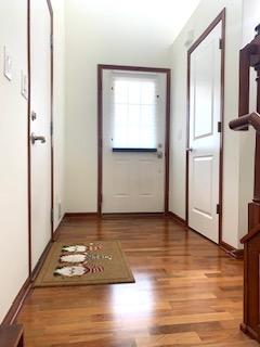 Main entry with hardwood floors and art nook.