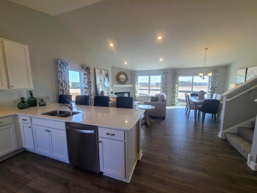 Open concept design with this large peninsula gives plenty space for entertaining. Photo is of actual home. Colors and options may vary. Ask Sales Agent for details.