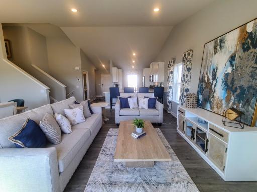 Open concept living with many ways to arrange furniture. Photo is of actual home. Colors and options may vary. Ask Sales Agent for details.