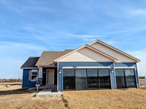 Welcome home to the Bryant II Northern Craftsman at Ravine Crossing in Cottage Grove! Photo is of actual home before landscaping. Options and colors may vary. Ask Sales Agent for details.