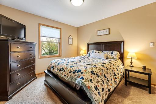 Upstairs bedroom #2 is bright and inviting, perfect for relaxation.
