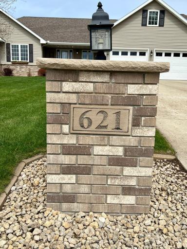 Brick pillars on both sides of the driveway