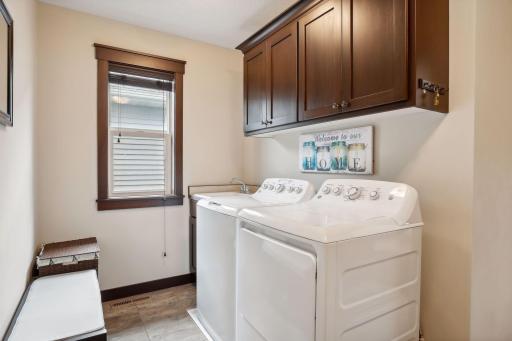 Main level laundry and mud room complete with window and utility sink, plus large closet.