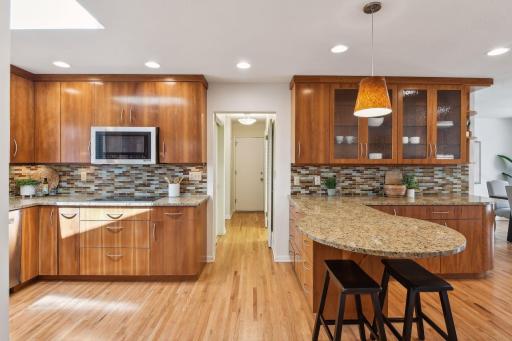 The perfect kitchen complete with Cherrywood cabinets, bar and ample storage.