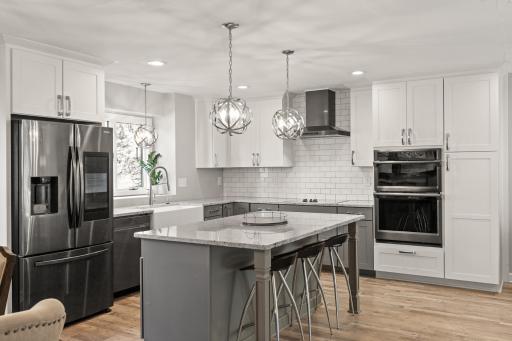 Gorgeous kitchen with new smart fridge & backsplash.