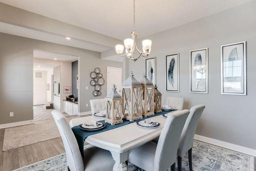 Speaking of flexible spaces - the home's front dining area is also loaded with uses. It too can provide the perfect office setting, as well as a formal dining space, or just another sitting room. Your call!!! (Photo of model, colors may vary)