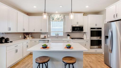 The anchor of the kitchen, the island will be coated with these same Quartz countertops and can serve as a perfect gathering piece for both family night, and while entertaining your guests! (Photo of model, colors may vary)