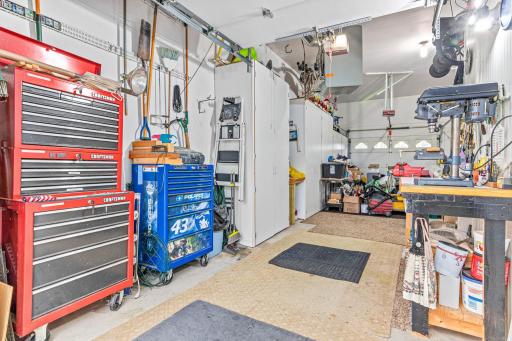 Attention garage lovers! This over 1000 sq.ft. HEATED garage is complete with a 4th door to the backyard, WORKSHOP AND next to the workbench there is ANOTHER STORAGE/WORKSHOP ROOM!